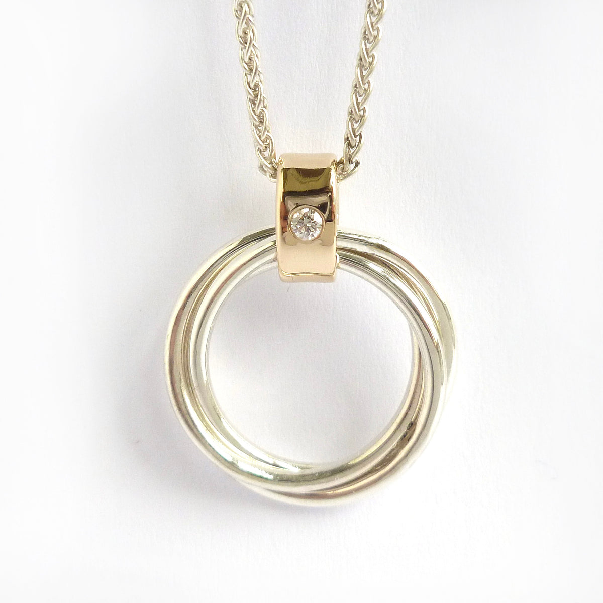 Contemporary Russian ring necklace in sterling silver with 9ct gold loop and flush set diamond by Sue Lane