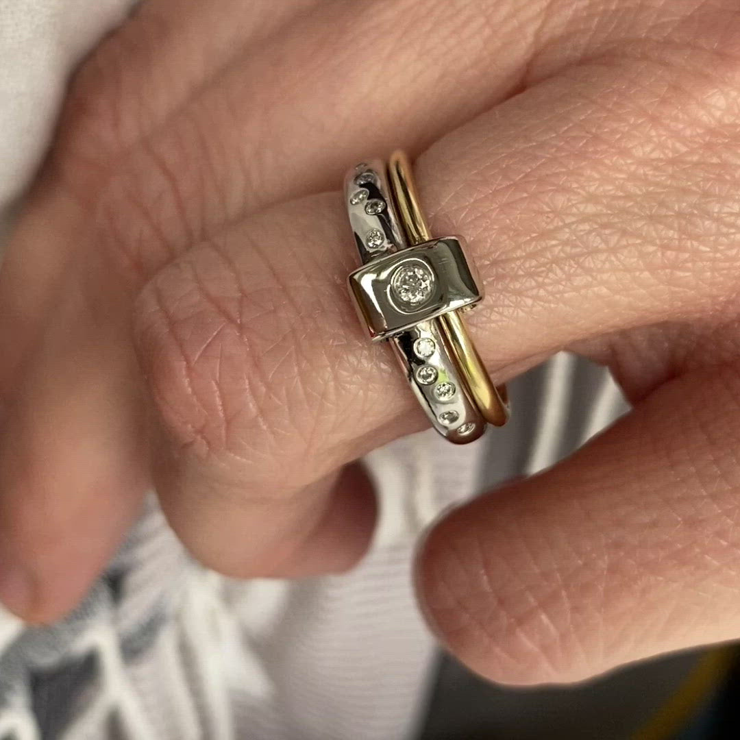 Contemporary platinum and 18ct yellow gold two band ring with diamonds