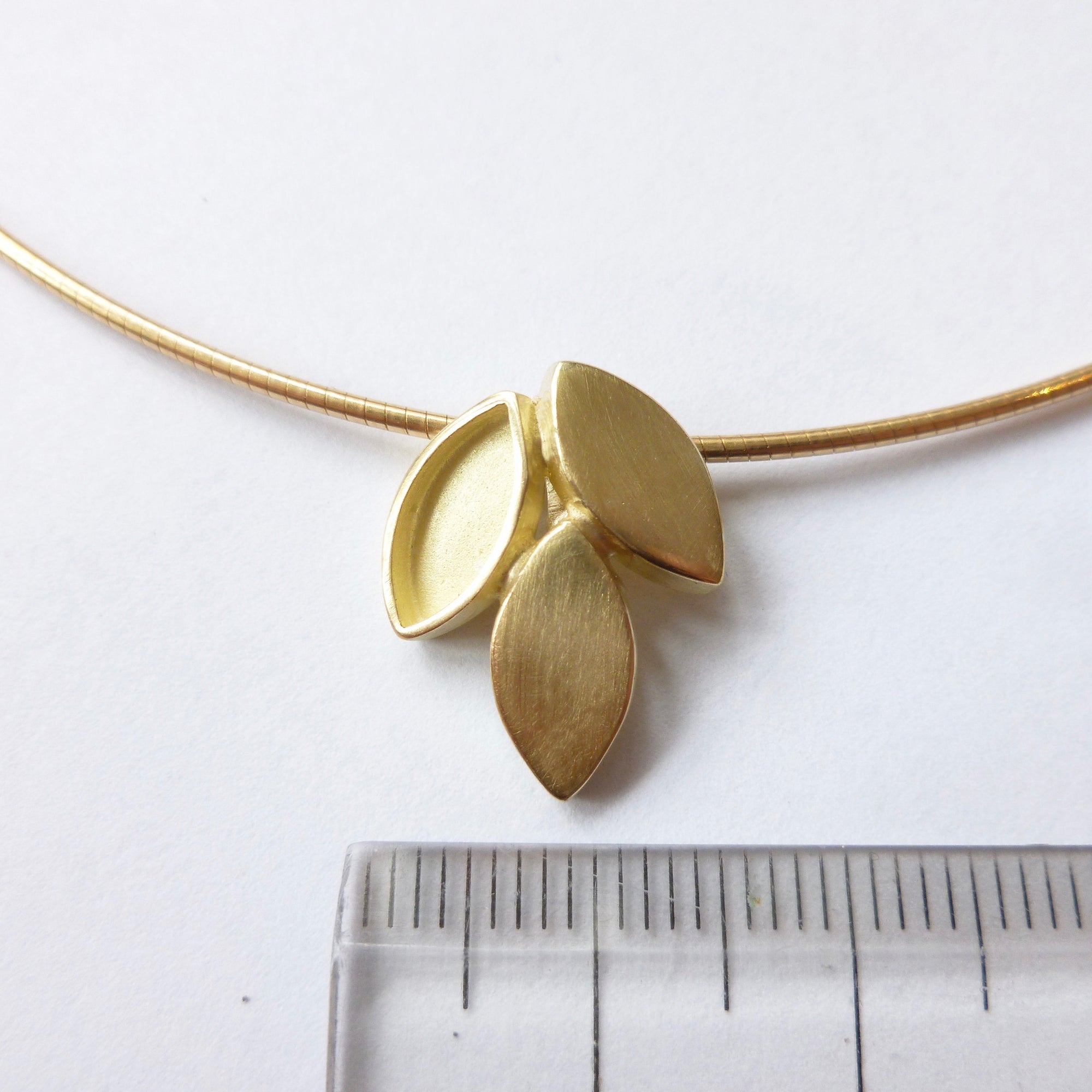modern and simple yellow gold leaf inspired necklace handmade by Sue Lane UK