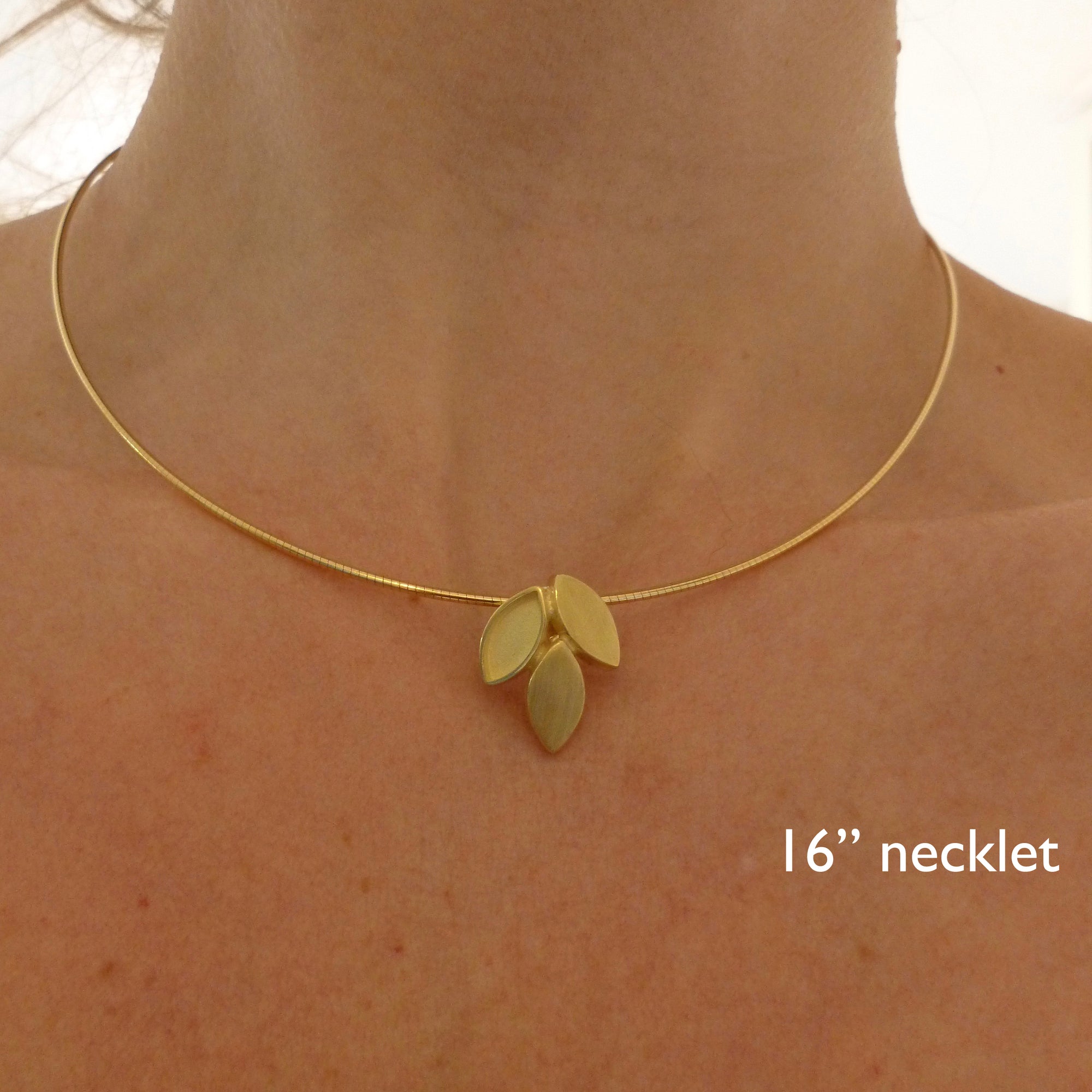 modern and simple yellow gold leaf inspired necklace handmade by Sue Lane UK
