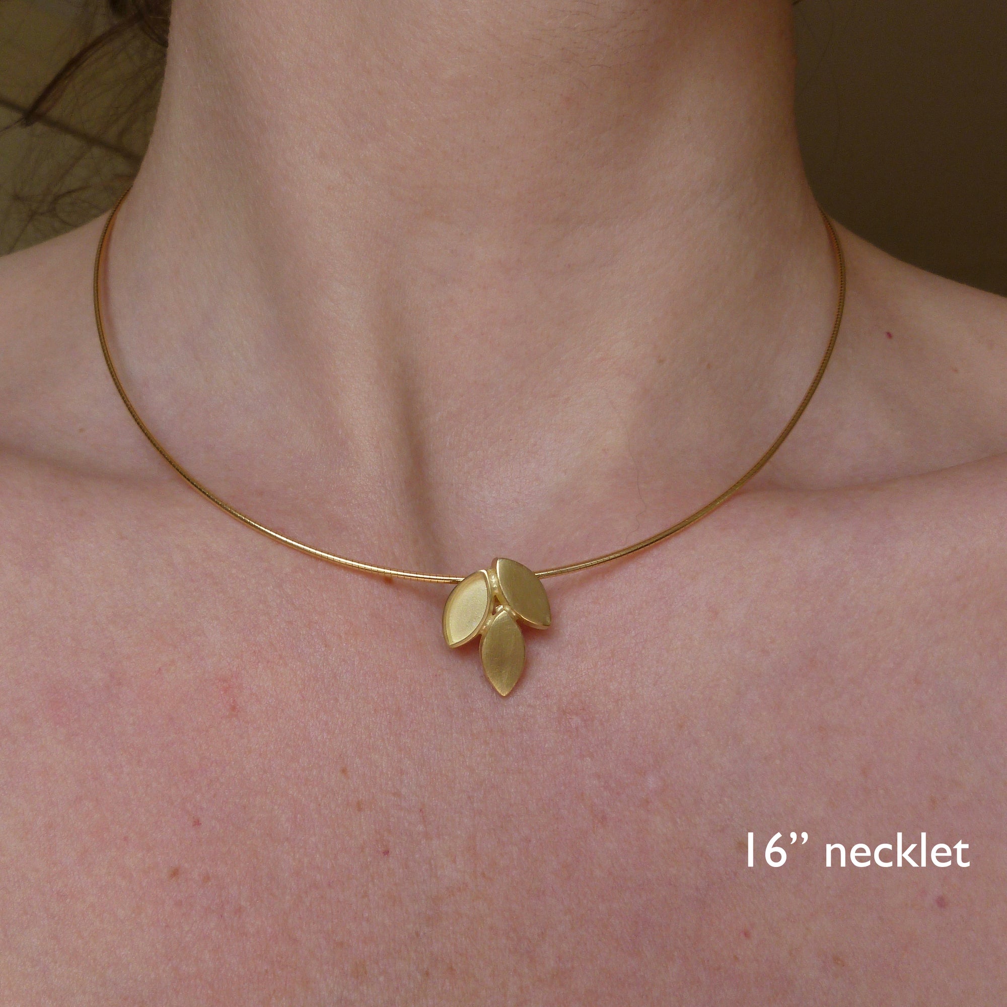 modern and simple yellow gold leaf inspired necklace handmade by Sue Lane UK