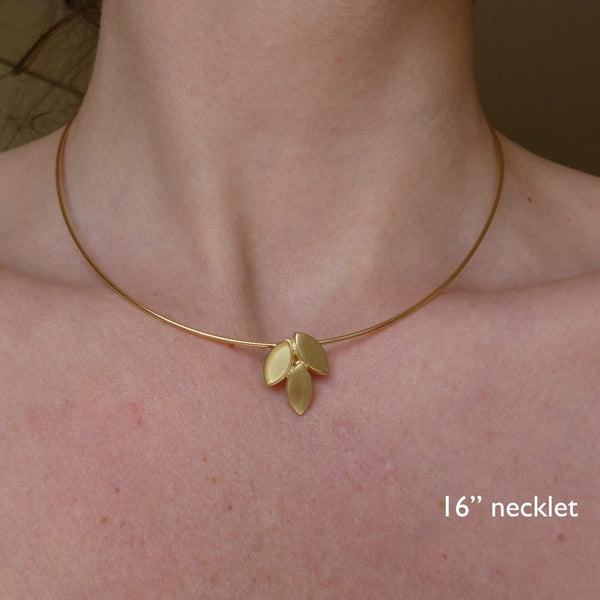modern and simple yellow gold leaf inspired necklace handmade by Sue Lane UK