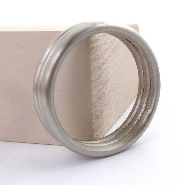 Contemporary modern wedding ring for men or women 18ct white gold
