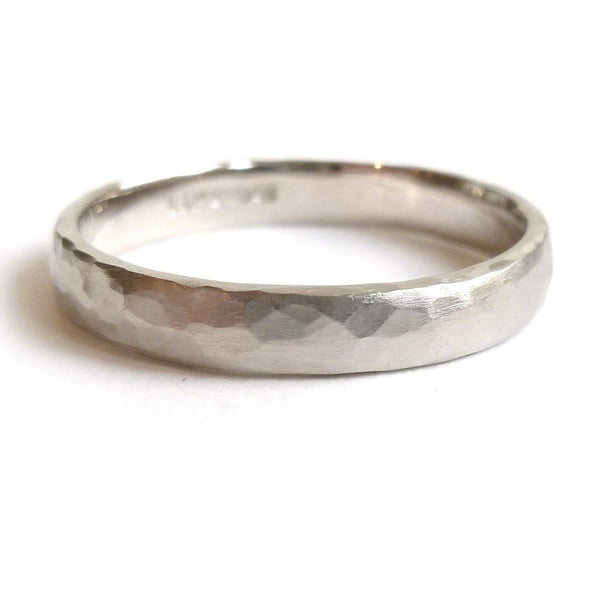 Contemporary, modern and bespoke hammered white gold wedding ring by designer maker Sue Lane Jewellery. Perfect wedding ring for men or women.