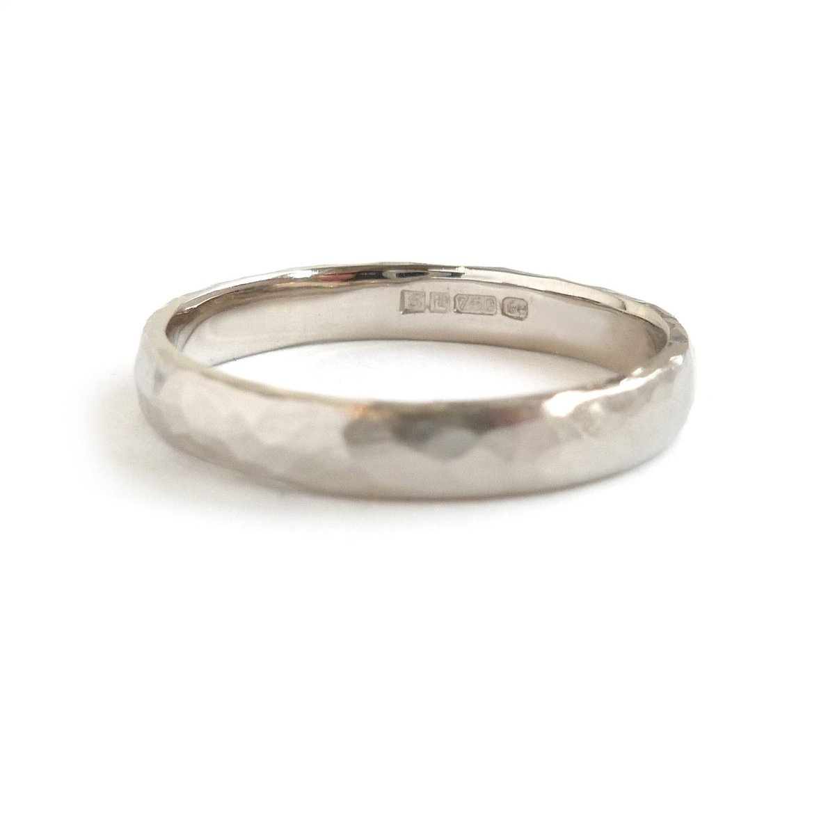 Contemporary, modern and bespoke hammered white gold wedding ring by designer maker Sue Lane Jewellery. Perfect wedding ring for men or women.