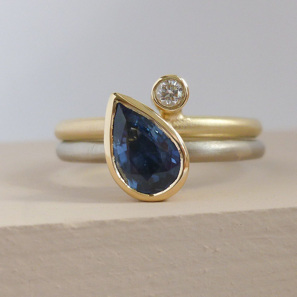Modern cornflower blue ethically sourced sapphire and diamond stacking ring set by Sue Lane. Multi band ring or interlocking ring, sometimes called double band ring too.