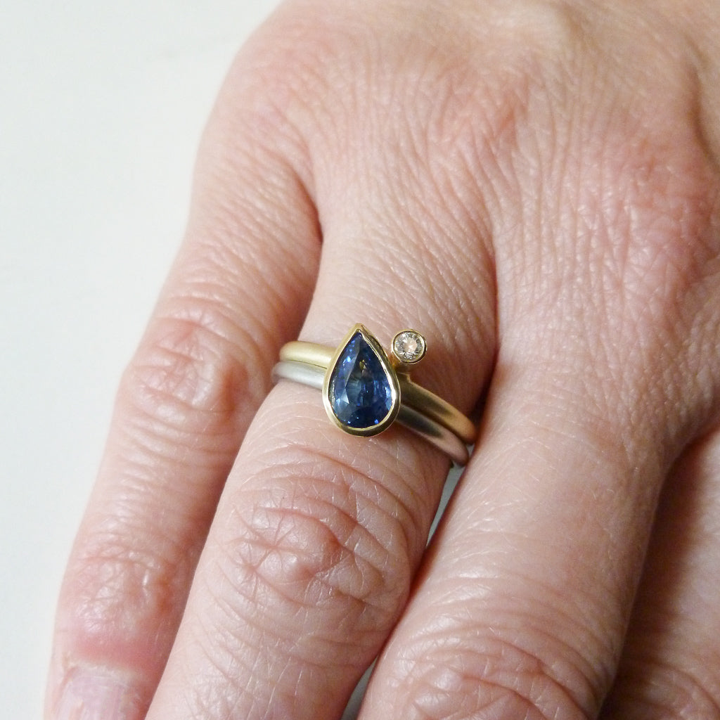 Modern cornflower blue ethically sourced sapphire and diamond stacking ring set by Sue Lane. Multi band ring or interlocking ring, sometimes called double band ring too.