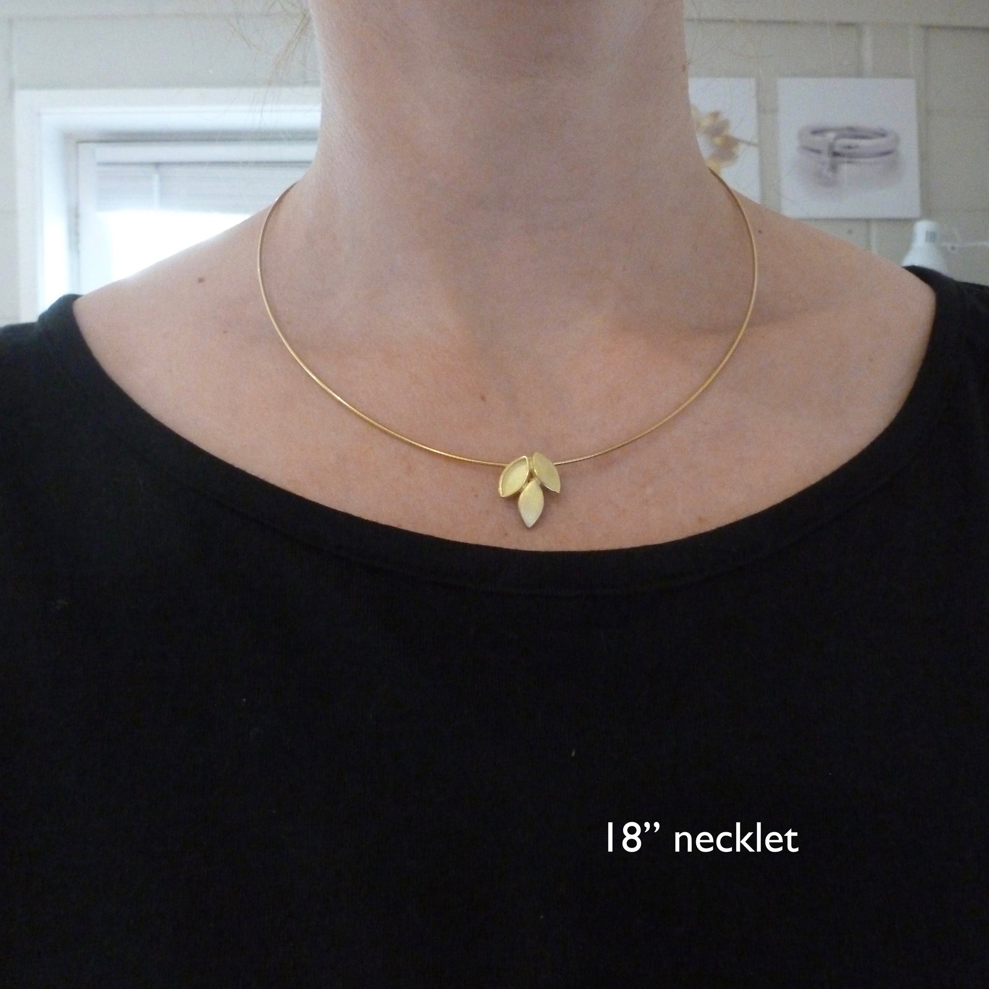 modern and simple yellow gold leaf inspired necklace handmade by Sue Lane UK
