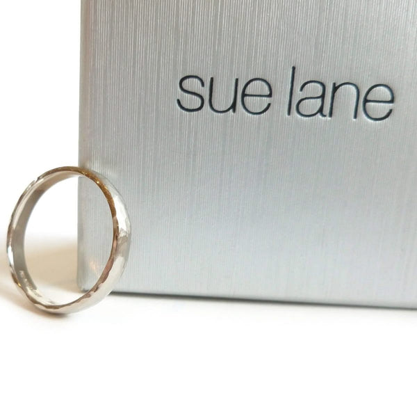 Contemporary, modern and bespoke hammered white gold wedding ring by designer maker Sue Lane Jewellery. Perfect wedding ring for men or women.