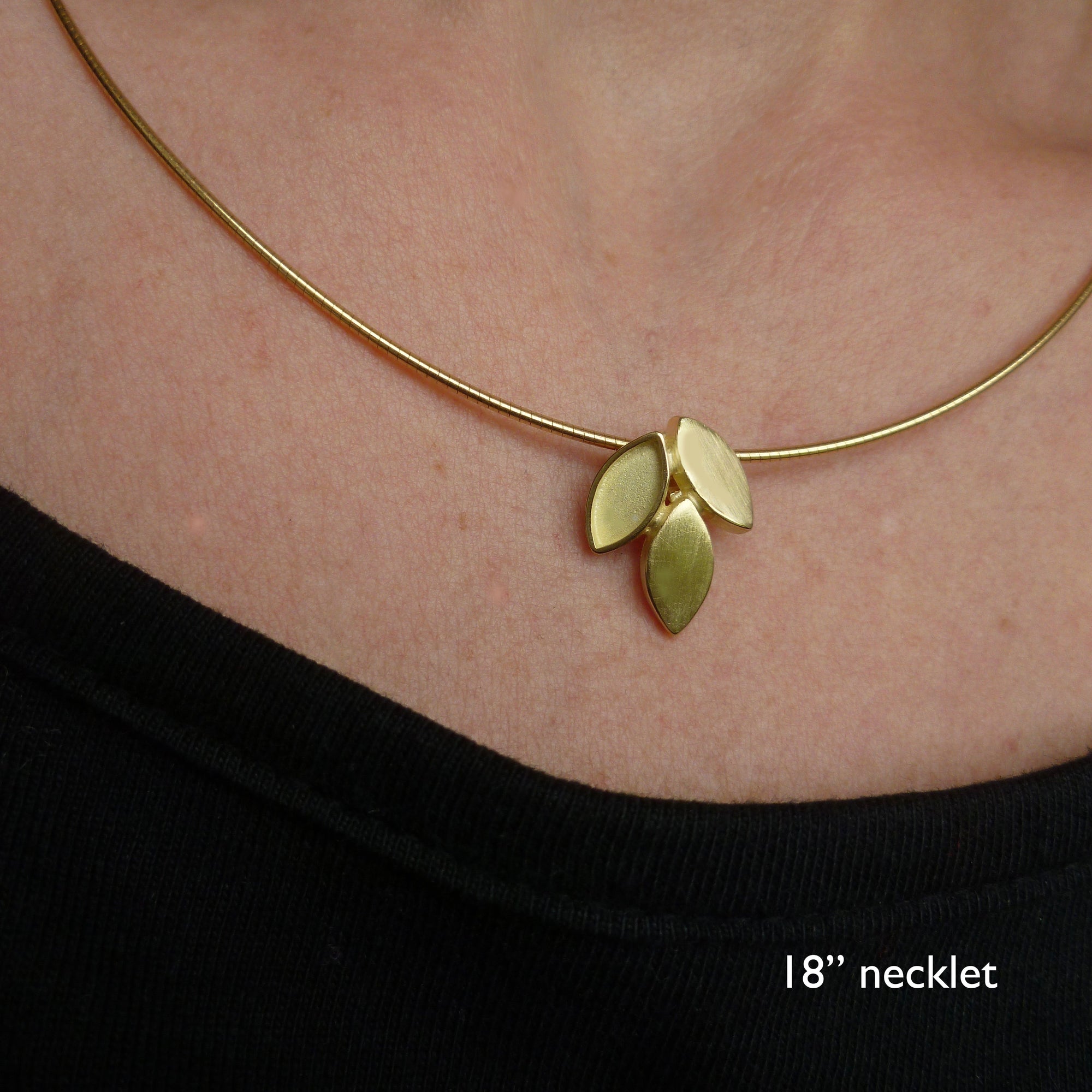 modern and simple yellow gold leaf inspired necklace handmade by Sue Lane UK