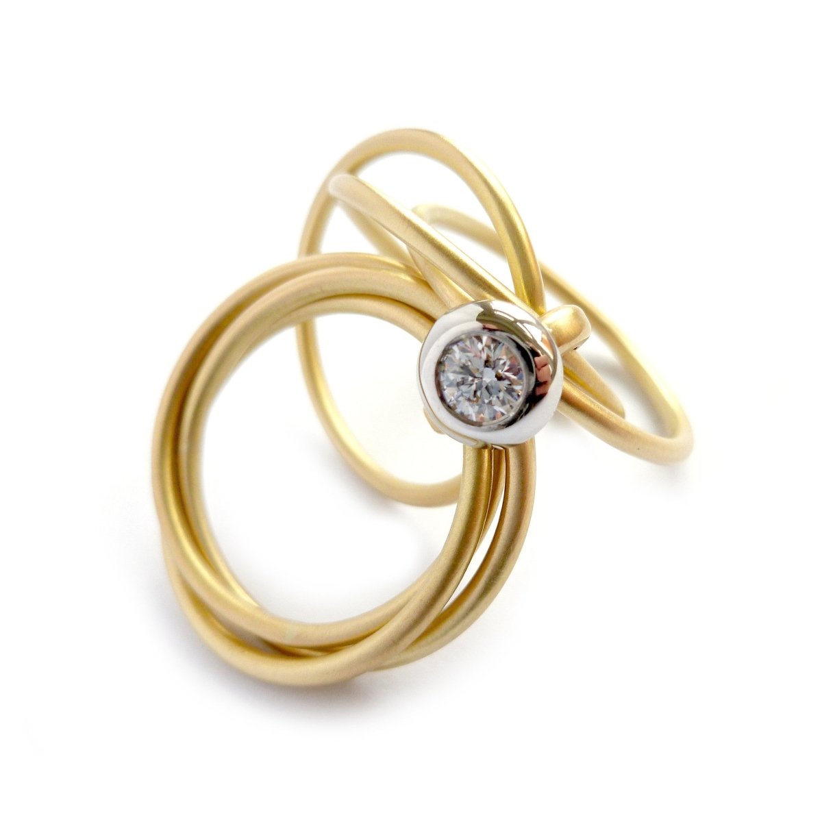 Contemporary, bespoke and modern yellow gold multi band engagement wedding ring, 0.25pt round white diamond, handmade by designer maker sue lane jewellery. Multi band ring or interlocking ring.