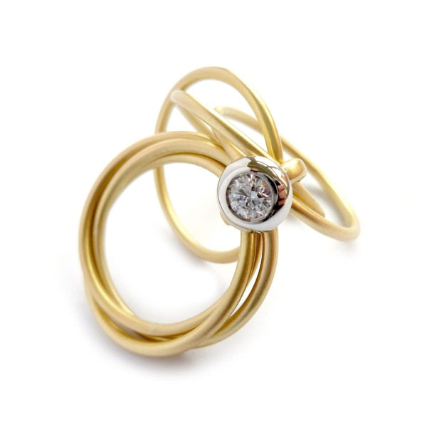 Contemporary, bespoke and modern yellow gold multi band engagement wedding ring, 0.25pt round white diamond, handmade by designer maker sue lane jewellery. Multi band ring or interlocking ring.
