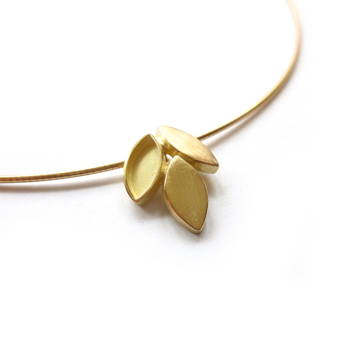 modern and simple yellow gold leaf inspired necklace handmade by Sue Lane UK