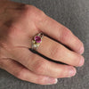 Platinum, 18ct gold, pink sapphire and two white diamonds ring. Contemporary, modern and unique.