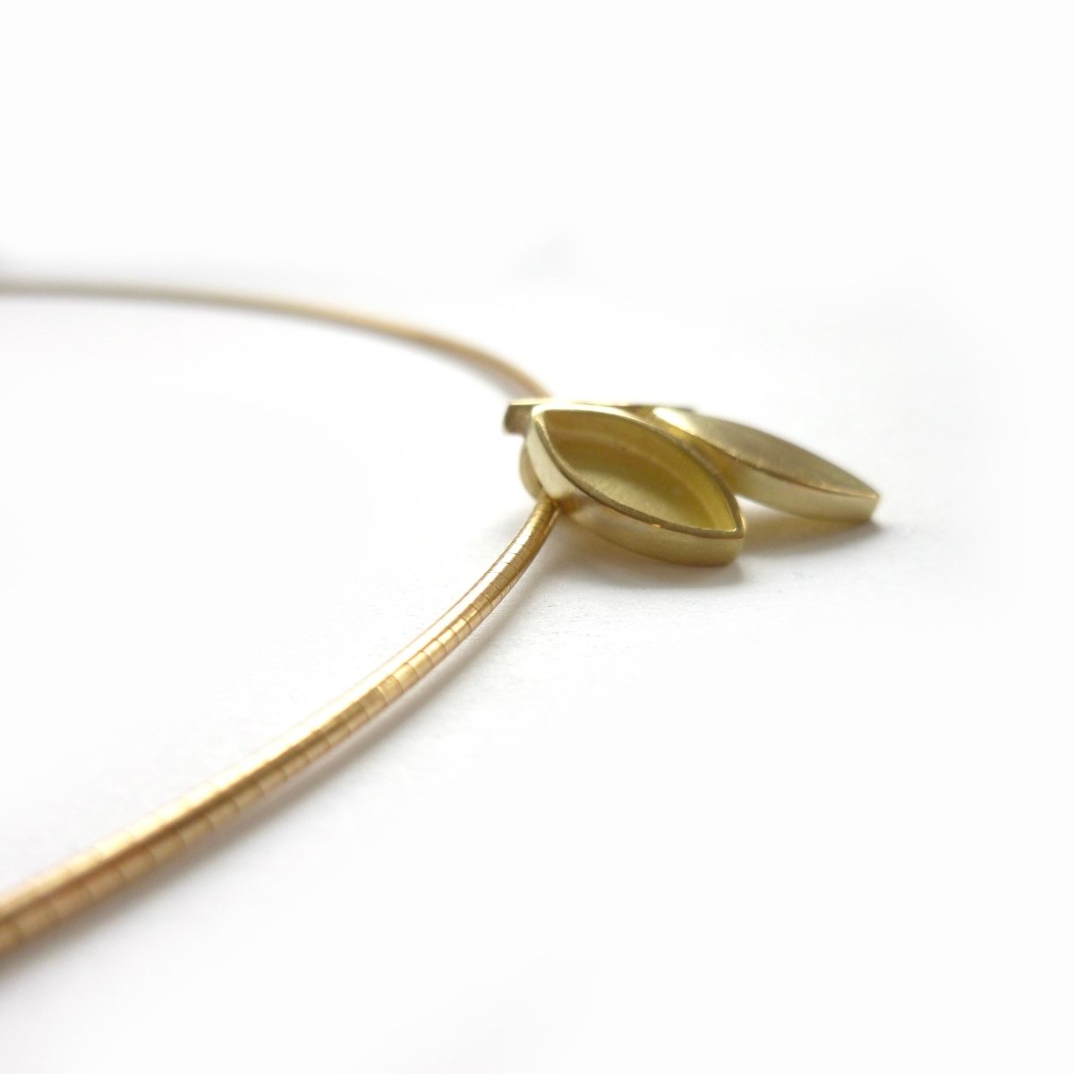 modern and simple yellow gold leaf inspired necklace handmade by Sue Lane UK