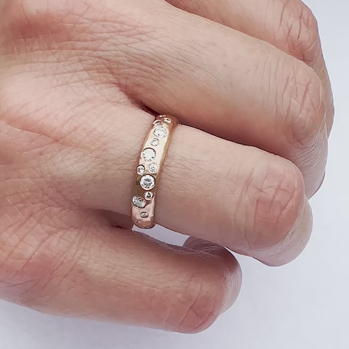 Contemporary 18ct rose gold band ring with scattered diamonds