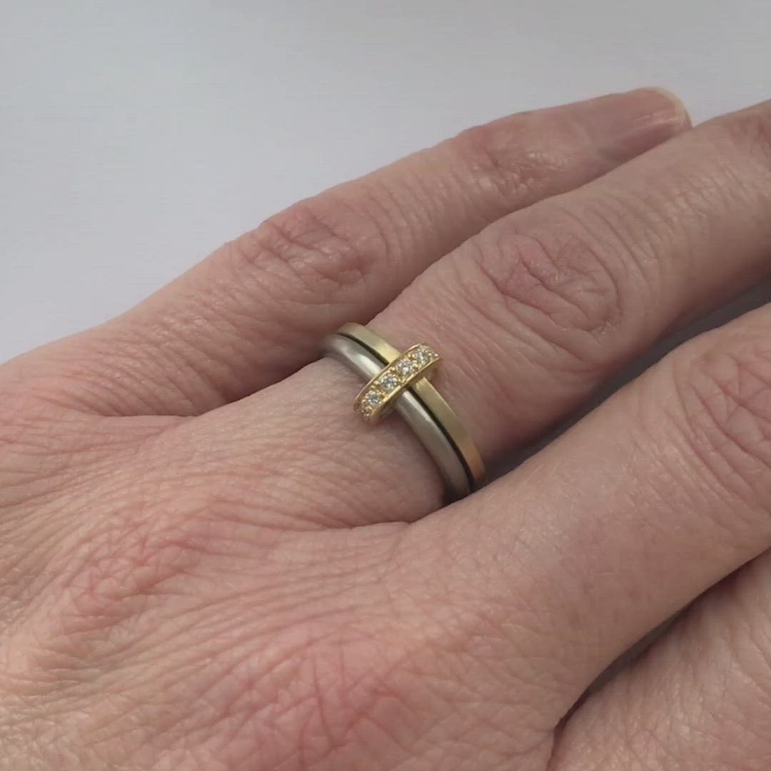 Modern and bespoke two band two tone ring with pave set diamonds. Modern, unique two band ring joined together with diamonds. An alternative eternity or wedding ring. Multi band ring or interlocking ring, sometimes called double band ring too.
