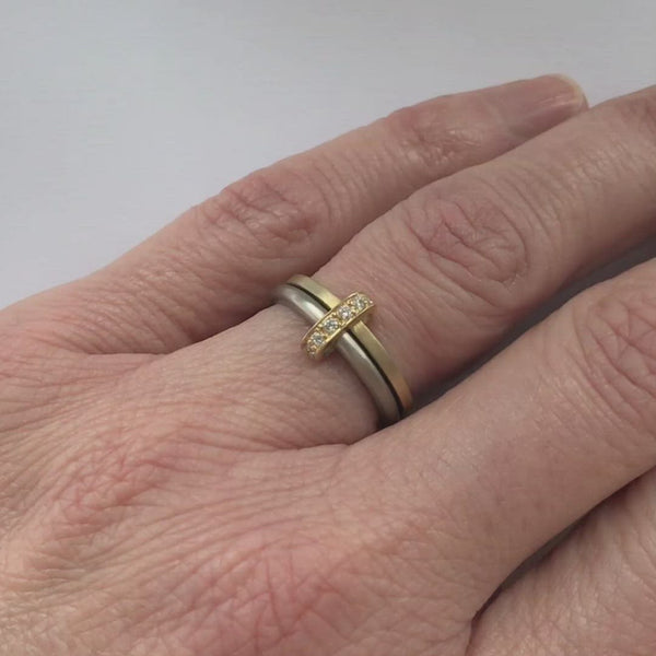 Modern and bespoke two band two tone ring with pave set diamonds. Modern, unique two band ring joined together with diamonds. An alternative eternity or wedding ring. Multi band ring or interlocking ring, sometimes called double band ring too.