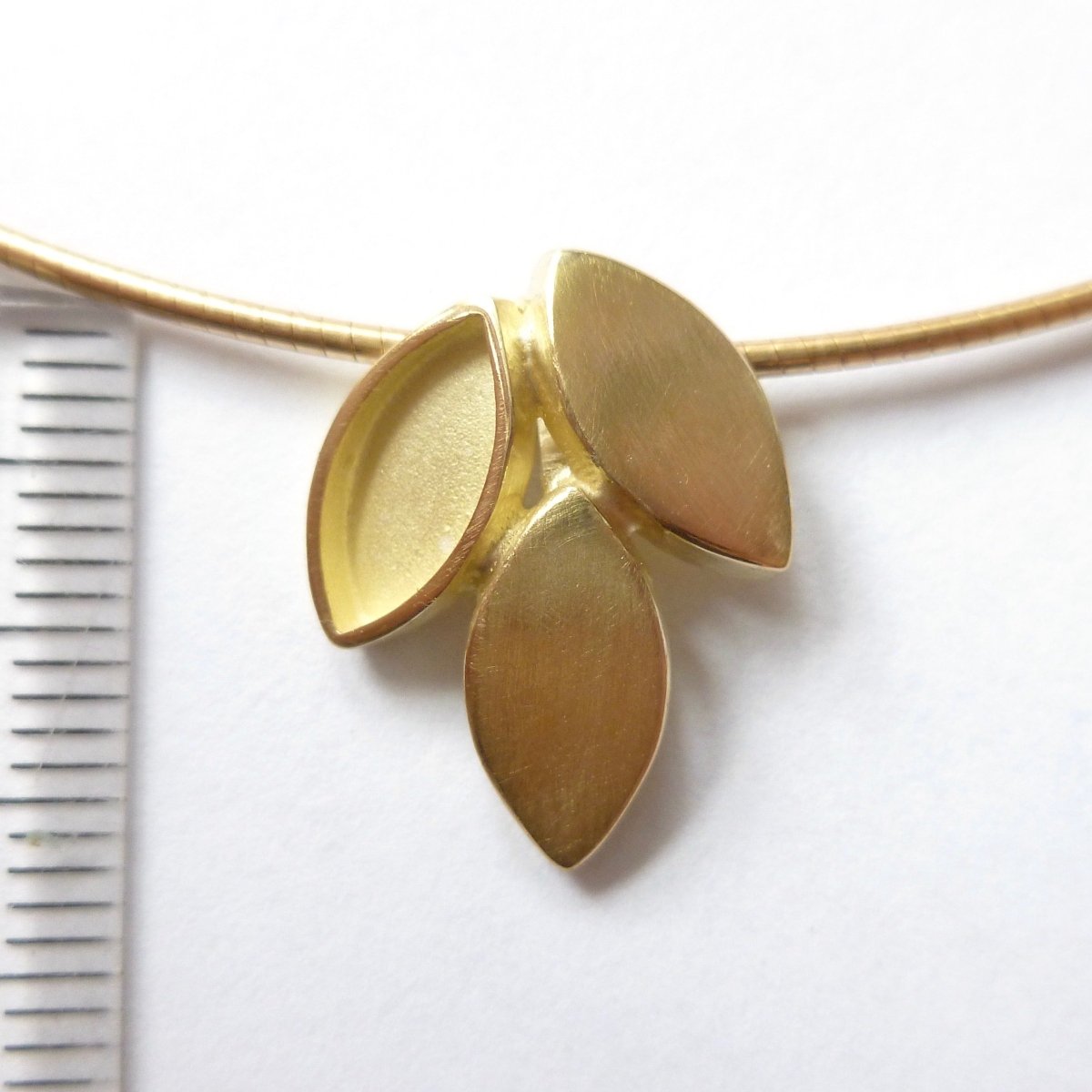 modern and simple yellow gold leaf inspired necklace handmade by Sue Lane UK