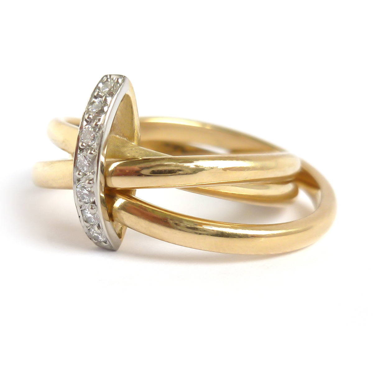 A unique contemporary unique two tone gold and diamond Russian style linked ring