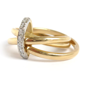 A unique contemporary unique two tone gold and diamond Russian style linked ring