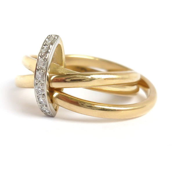 A unique contemporary unique two tone gold and diamond Russian style linked ring