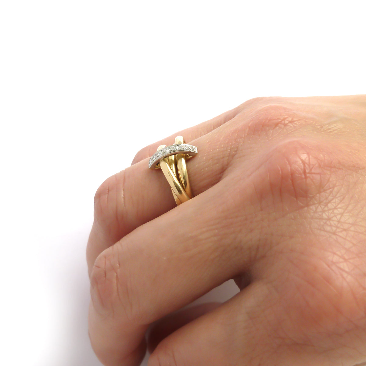 A unique contemporary unique two tone gold and diamond Russian style linked ring