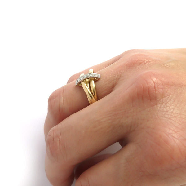 A unique contemporary unique two tone gold and diamond Russian style linked ring
