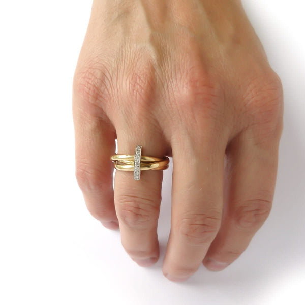 A unique contemporary unique two tone gold and diamond Russian style linked ring