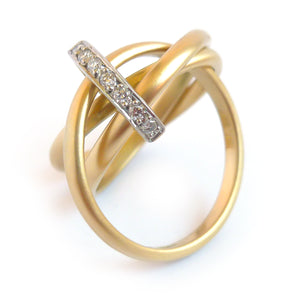 A unique contemporary unique two tone gold and diamond Russian style linked ring