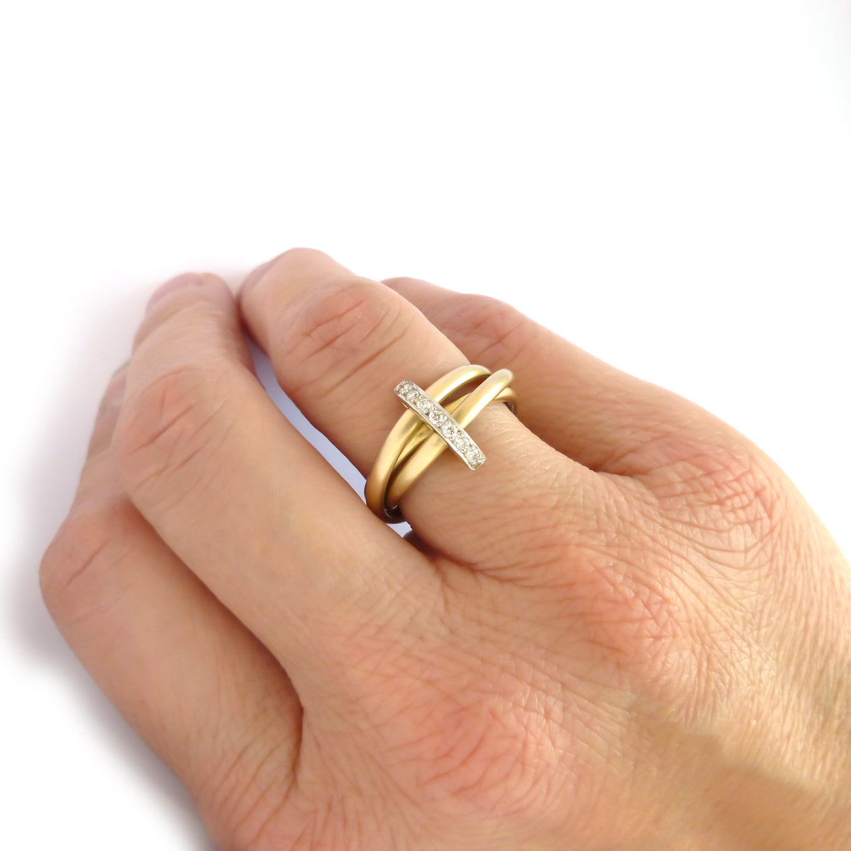 A unique contemporary unique two tone gold and diamond Russian style linked ring