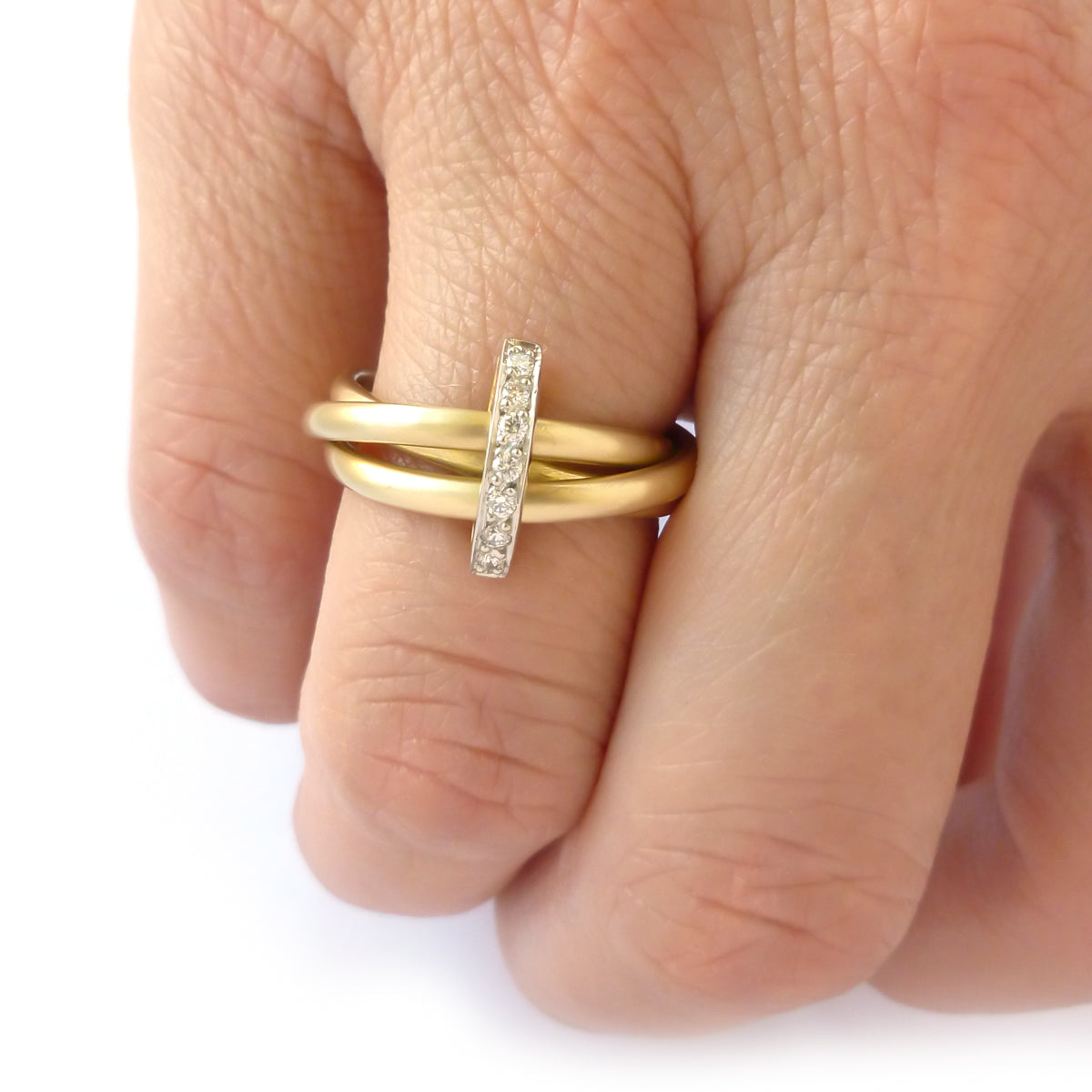 A unique contemporary unique two tone gold and diamond Russian style linked ring