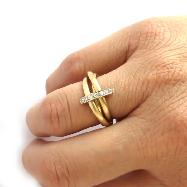 A unique contemporary unique two tone gold and diamond Russian style linked ring