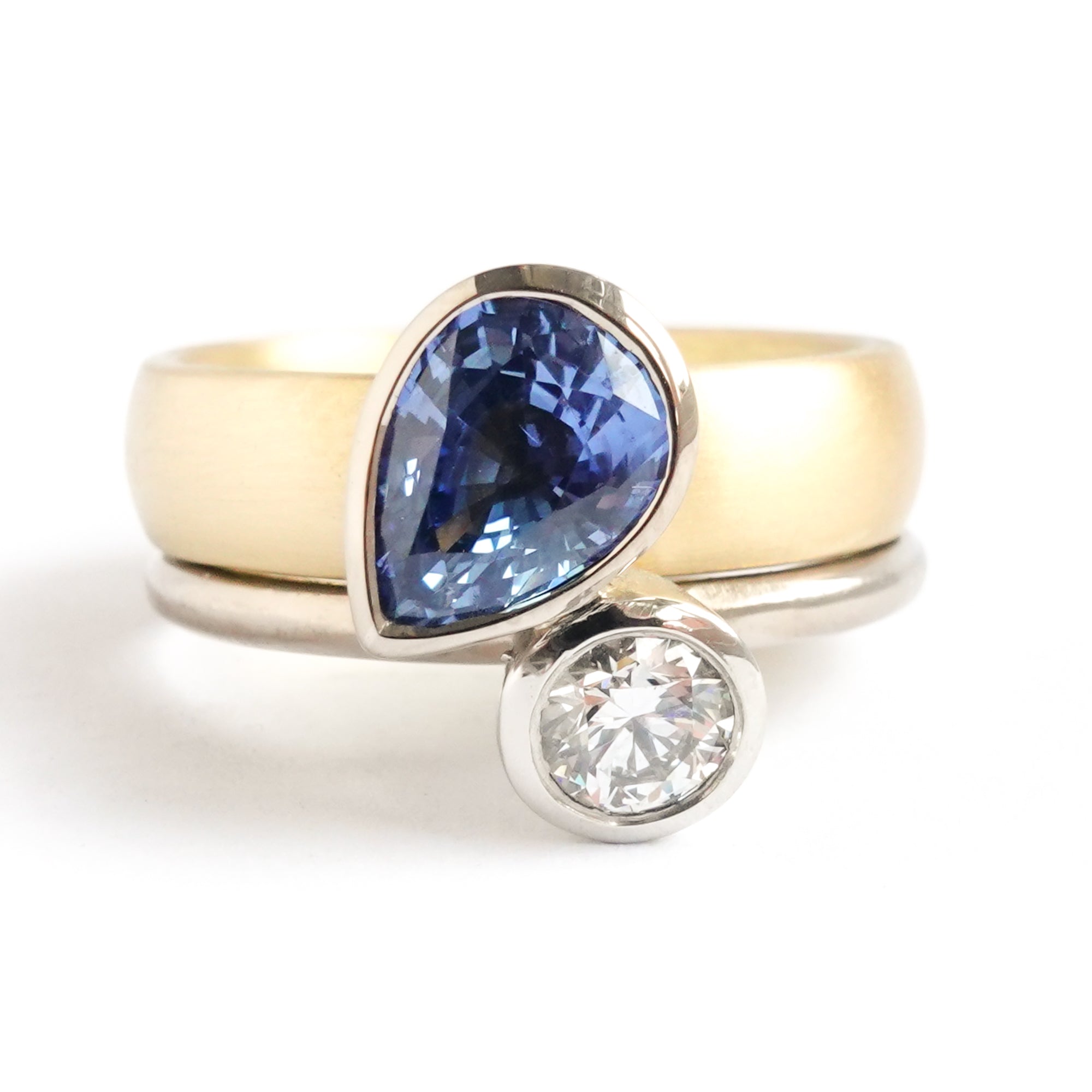 Contemporary, modern and bespoke silver, blue sapphire and diamond handmade stacking ring, by jewellery designer Sue Lane.