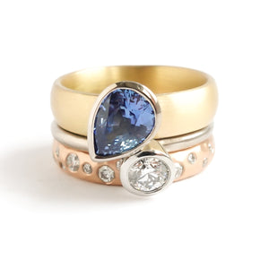 Contemporary, modern and bespoke silver, blue sapphire and diamond handmade stacking ring, by jewellery designer Sue Lane.