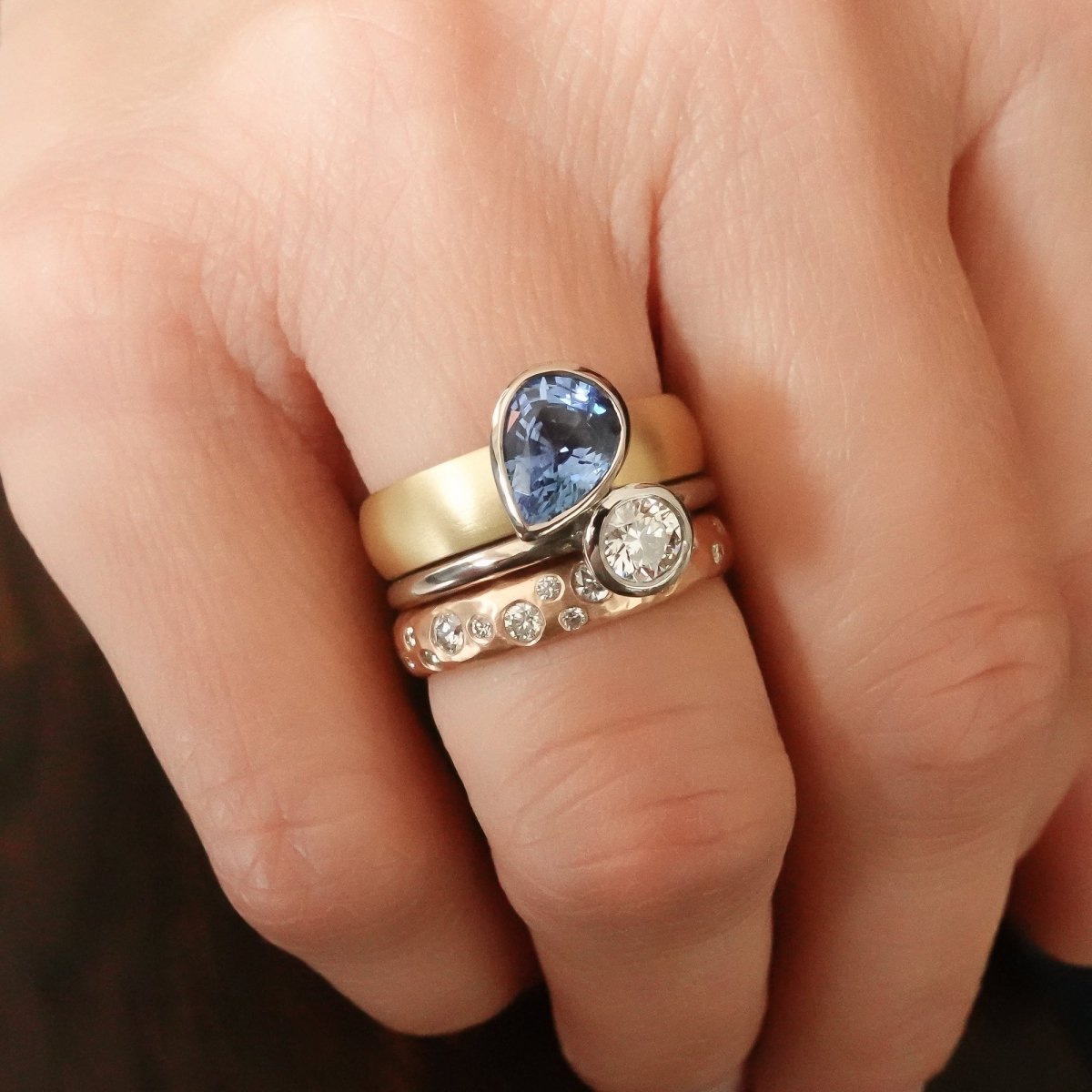 Contemporary, modern and bespoke silver, blue sapphire and diamond handmade stacking ring, by jewellery designer Sue Lane.