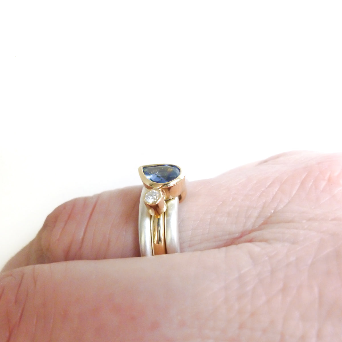 A contemporary bespoke unique aquamarine and diamond gold and silver ring by Sue Lane