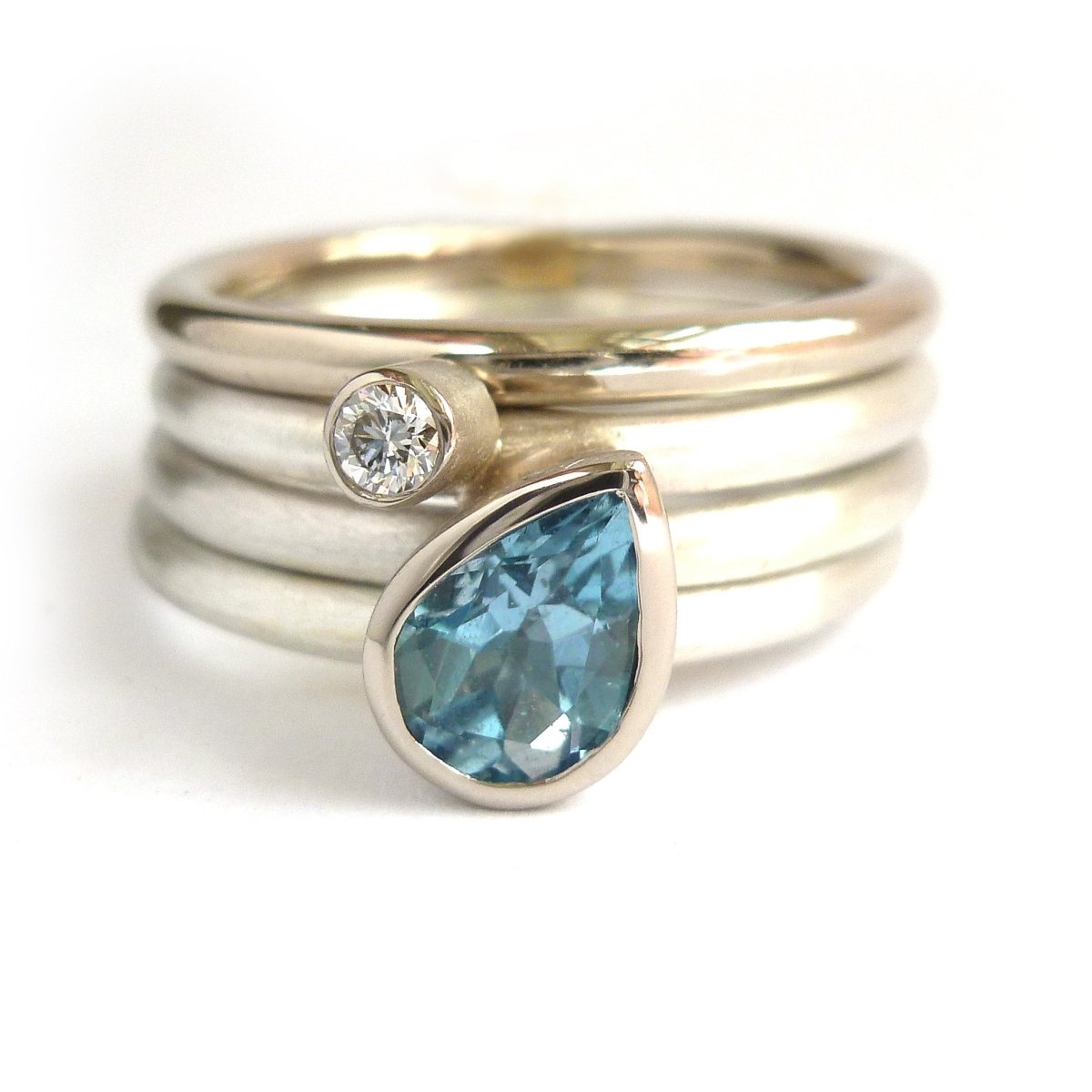 A unique, contemporary aquamarine and diamond gold and silver ring