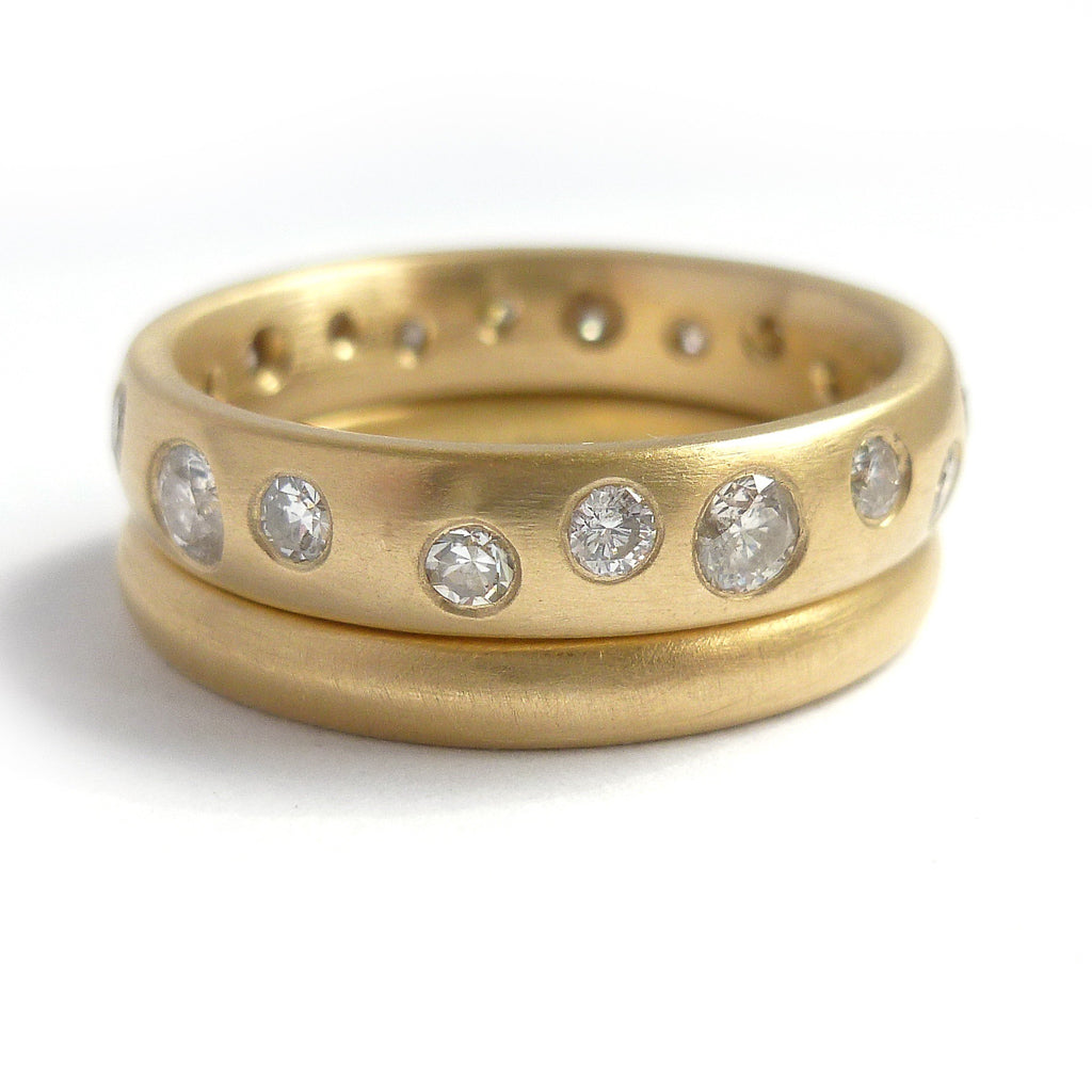 A modern unique eternity ring with 20 diamonds. Beautiful contemporary wedding, eternity or engagement ring.