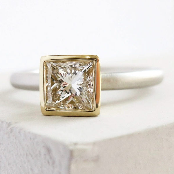A beautiful, contemporary platinum and 18ct yellow engagement ring.