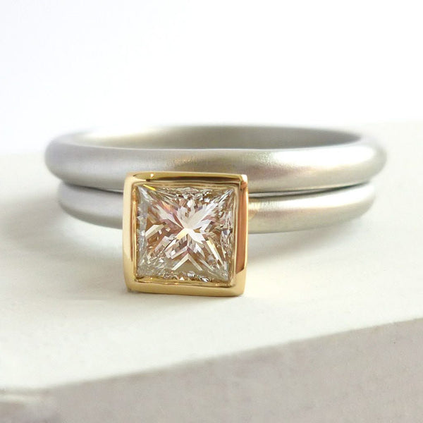 A beautiful, contemporary platinum and 18ct yellow engagement ring.