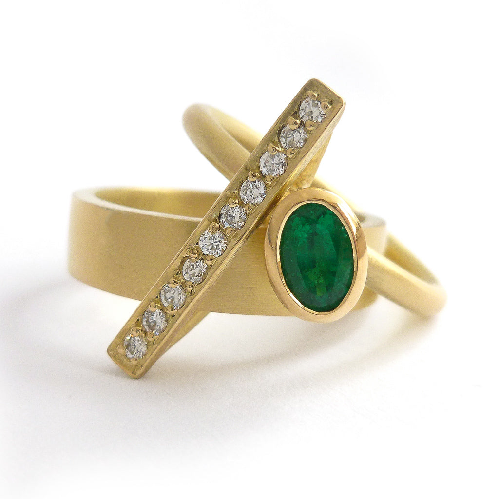 One off contemporary ring with lovely emerald and pave set diamonds. Totally bespoke and unique.