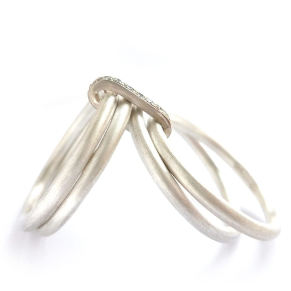 Modern handmade four band spinner ring, linked together 