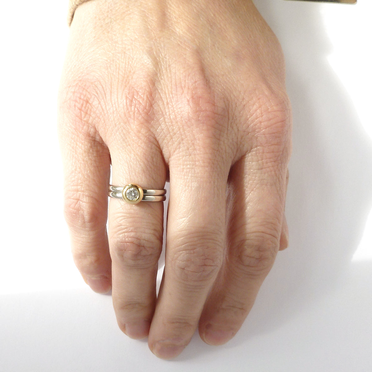Contemporary jewellery engagement ring. Remodelling commissioning. Double band ring that's interlocking