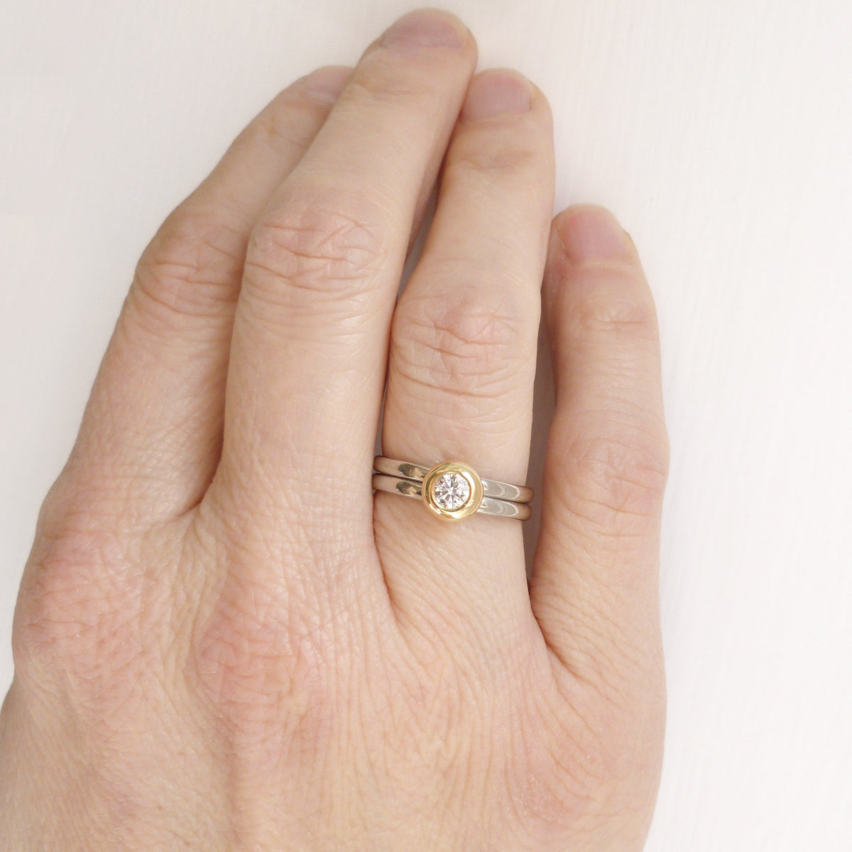 Contemporary jewellery engagement ring. Remodelling commissioning. Multi band ring or interlocking ring, sometimes called double band ring too.
