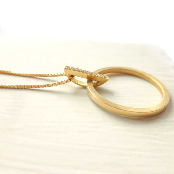 Contemporary jewellery, gold and diamond bespoke handmade necklace pendant.