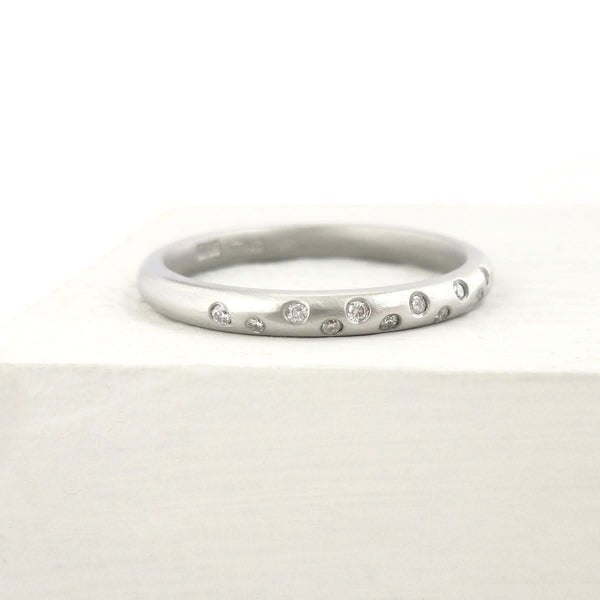 Contemporary, unique, bespoke and modern platinum diamond wedding ring, engagement ring, eternity ring, matt brushed finish. Handmade by designer maker Sue Lane