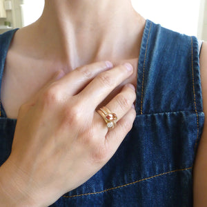 Contemporary rose gold and pear shaped imperial topaz stacking interlocking ring set.