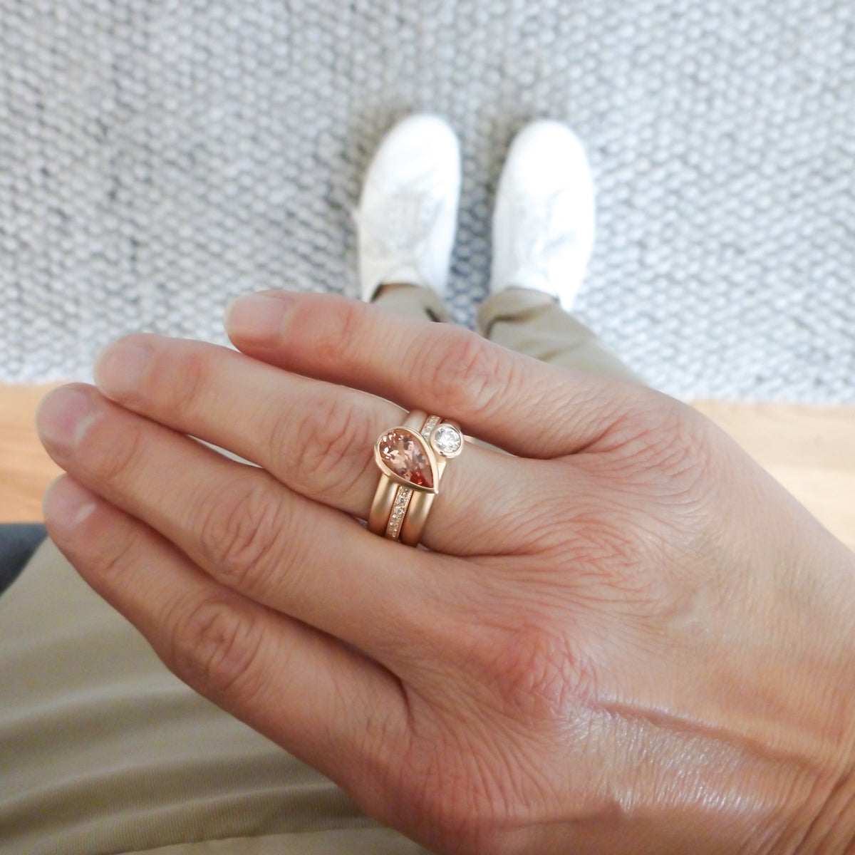 Contemporary rose gold and pear shaped imperial topaz stacking interlocking ring set.