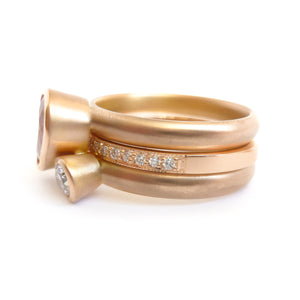 Contemporary rose gold and pear shaped imperial topaz stacking interlocking ring set.